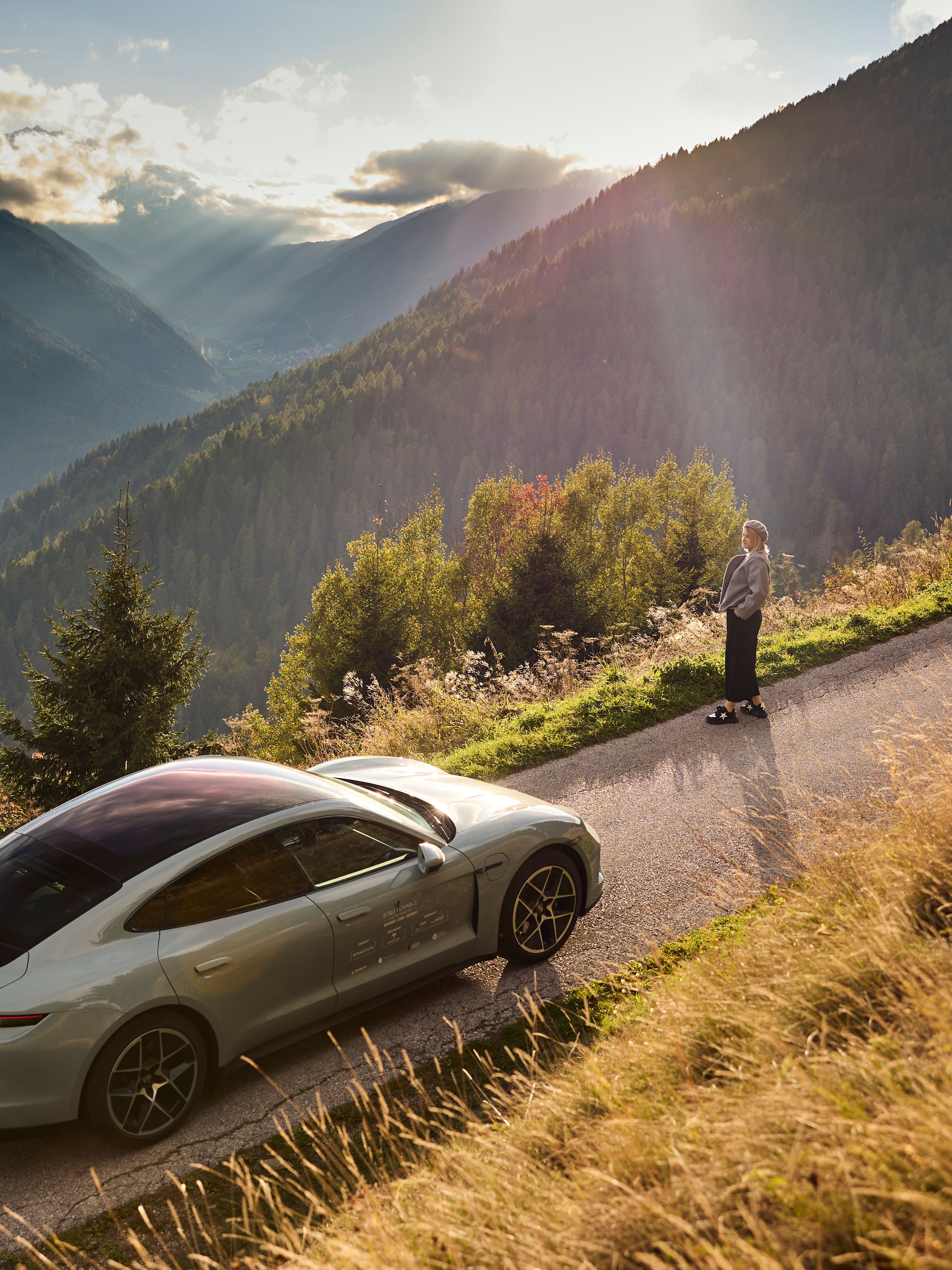 Car driving up a mountain on a road