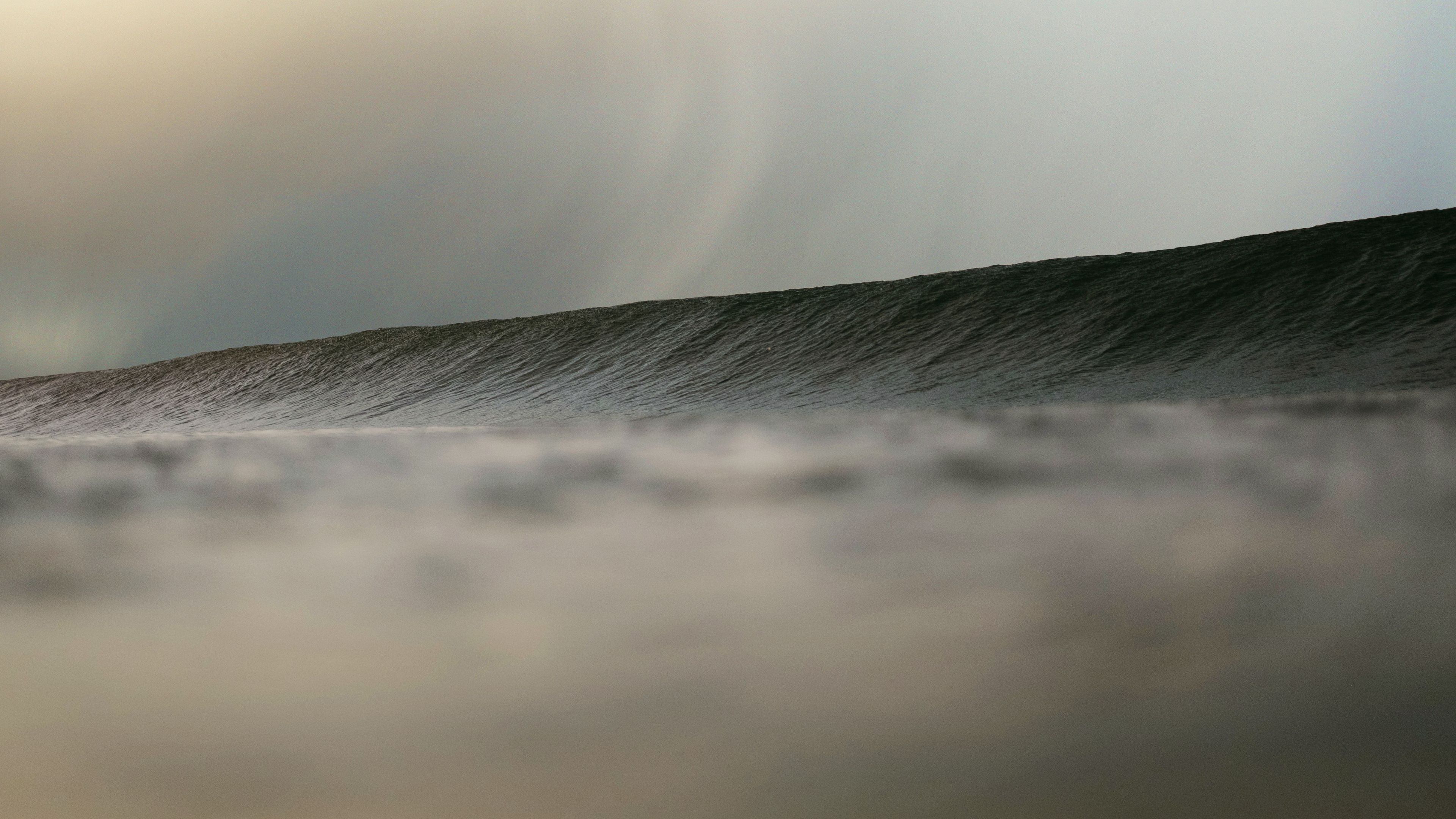 big waves under a gloomy sky