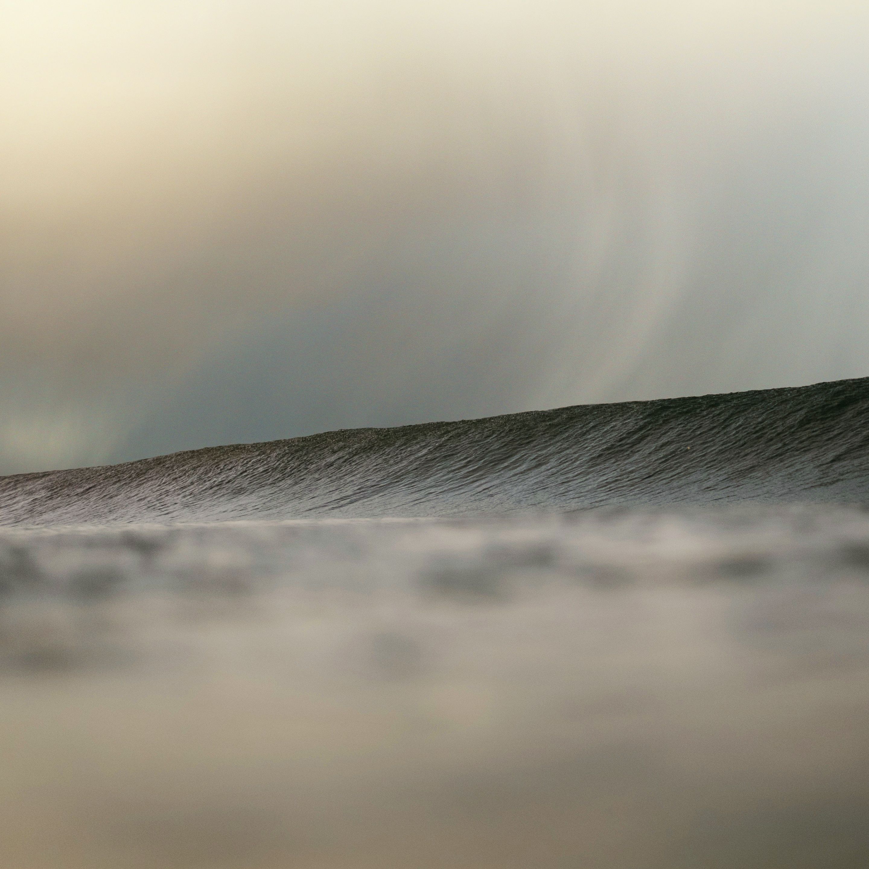 big waves under a gloomy sky