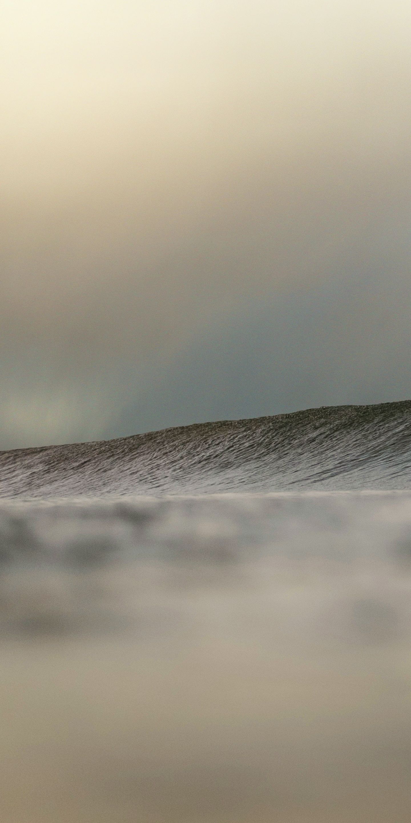 big waves under a gloomy sky