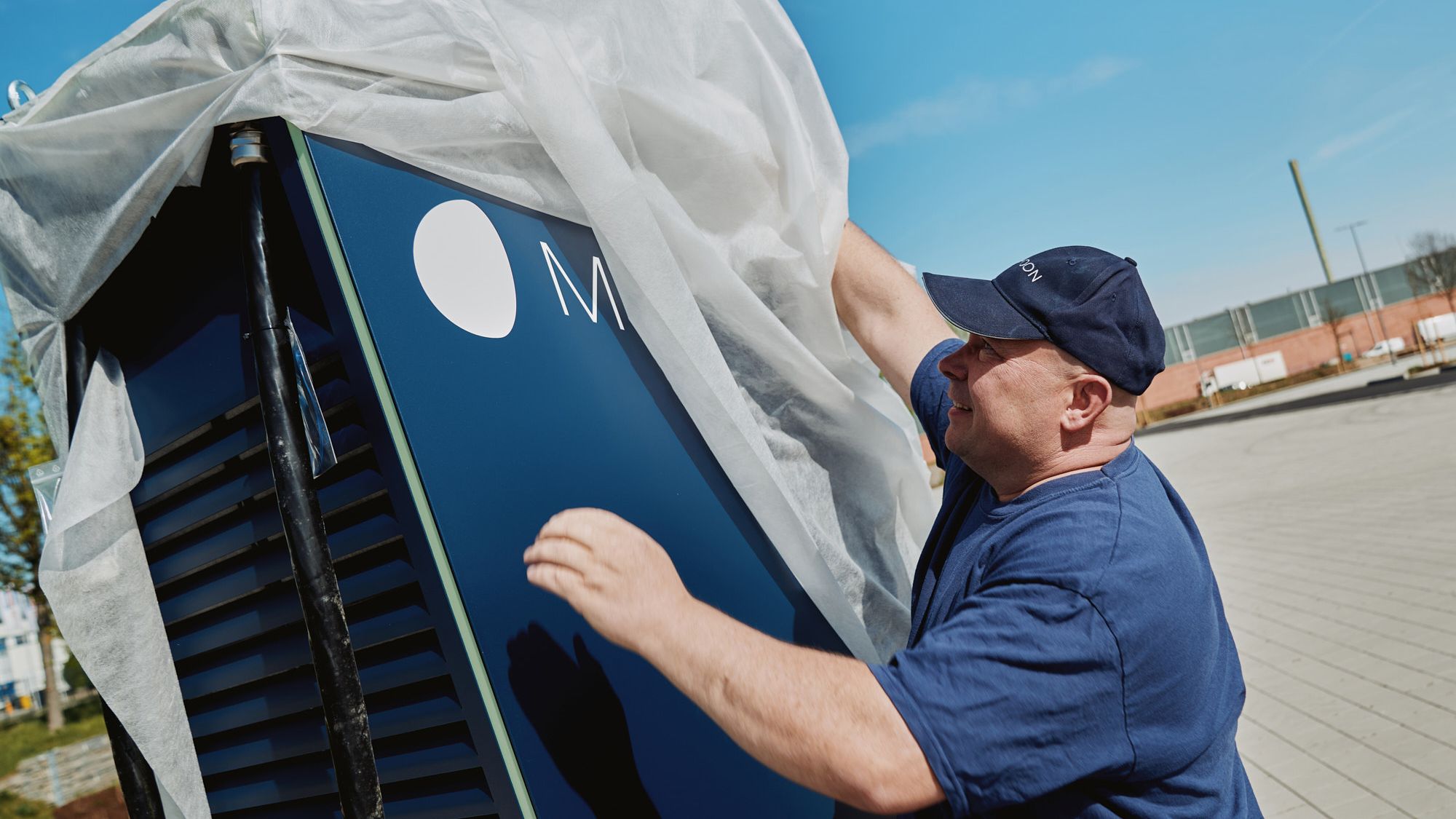 A man unpacks a POWER Charger