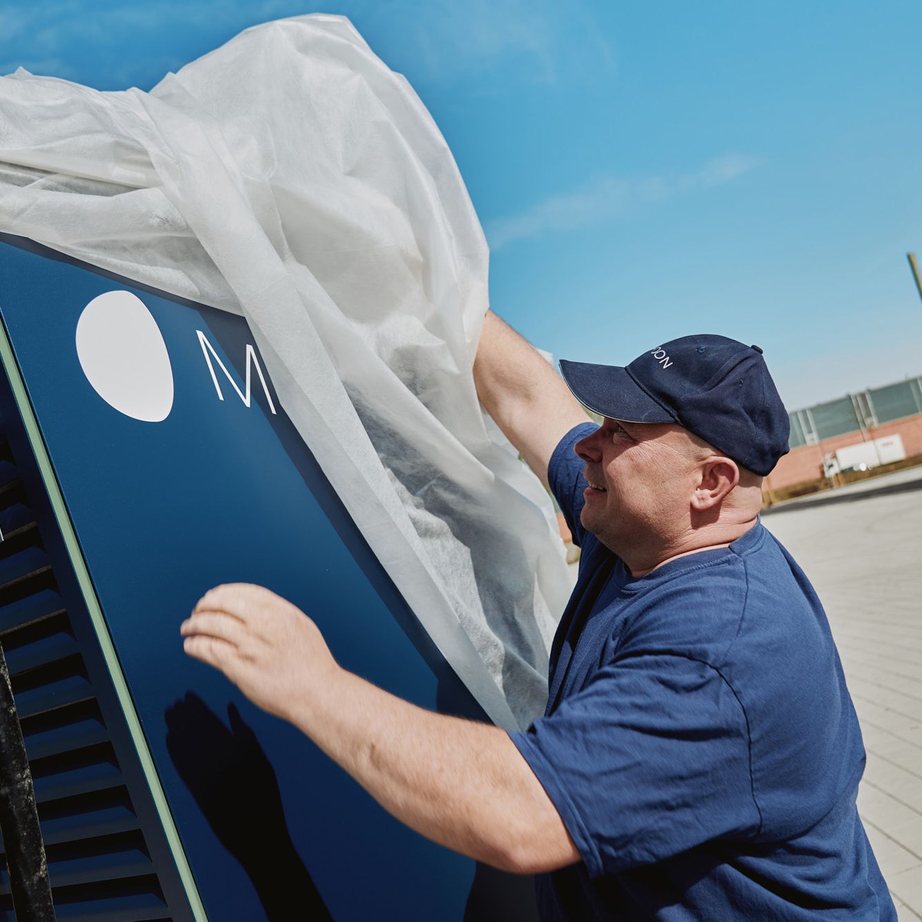 A man unpacks a POWER Charger