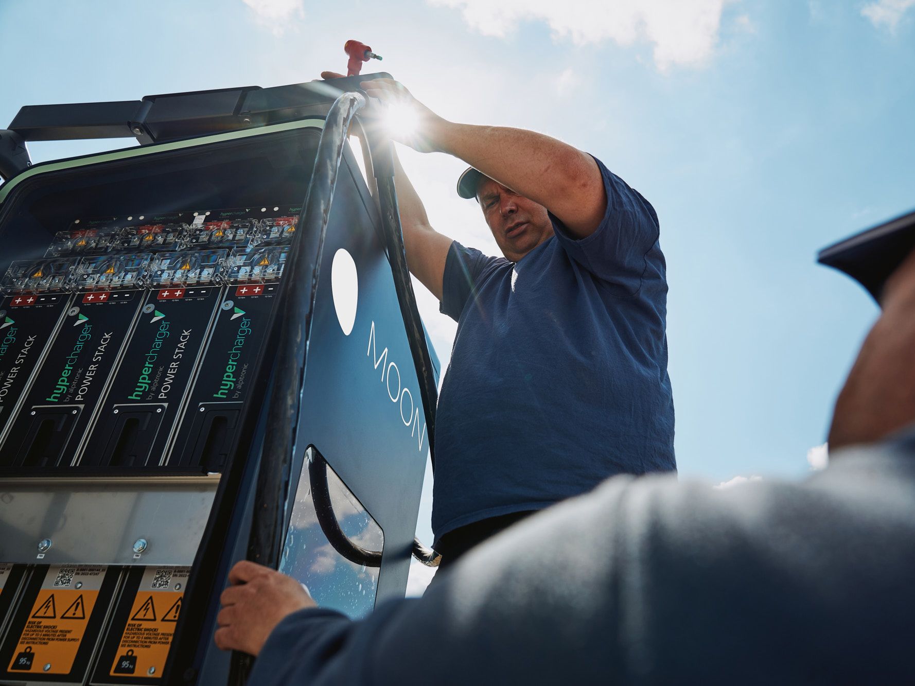 two men assemble the POWER Charger