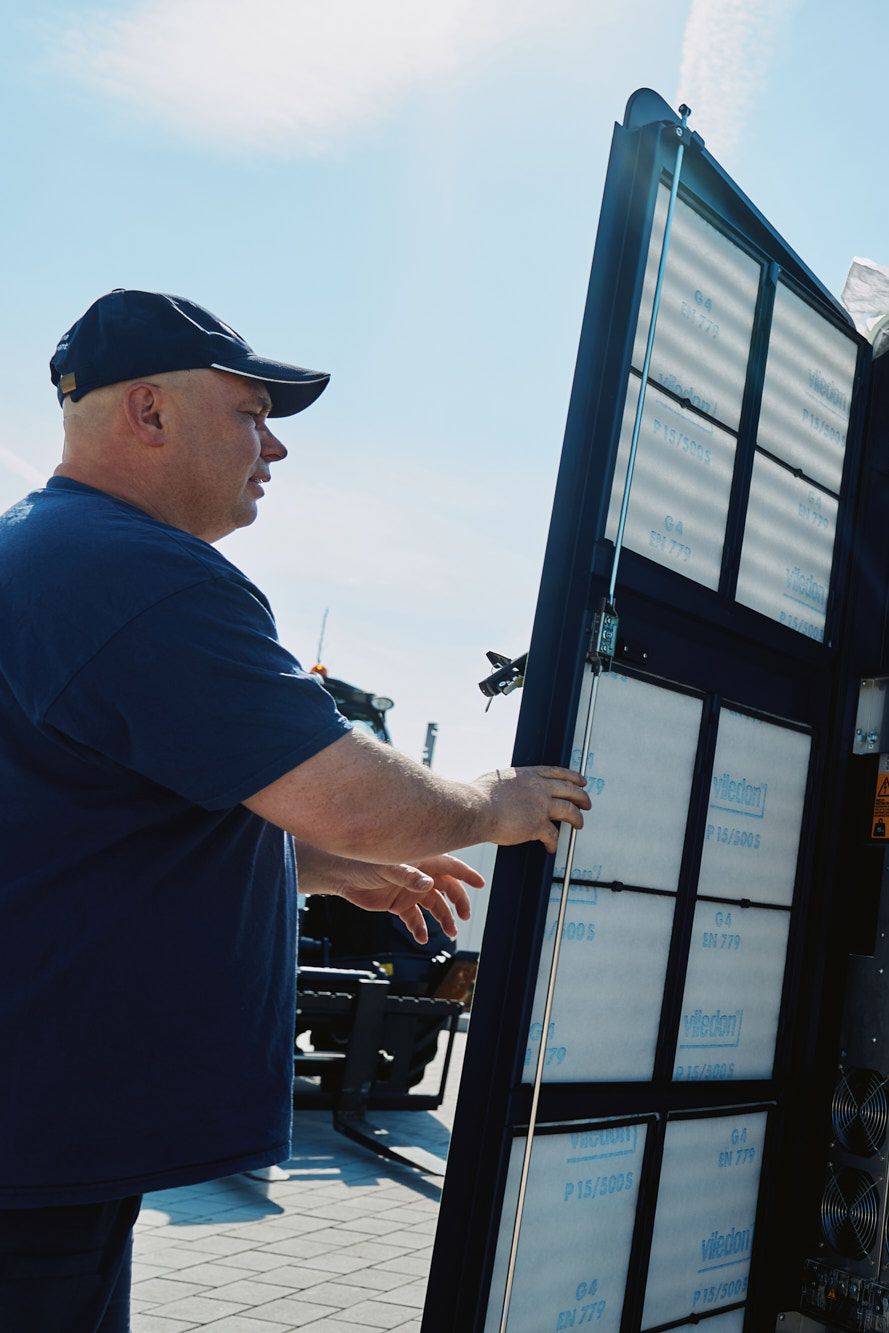 two men carry out the installation of a POWER Charger