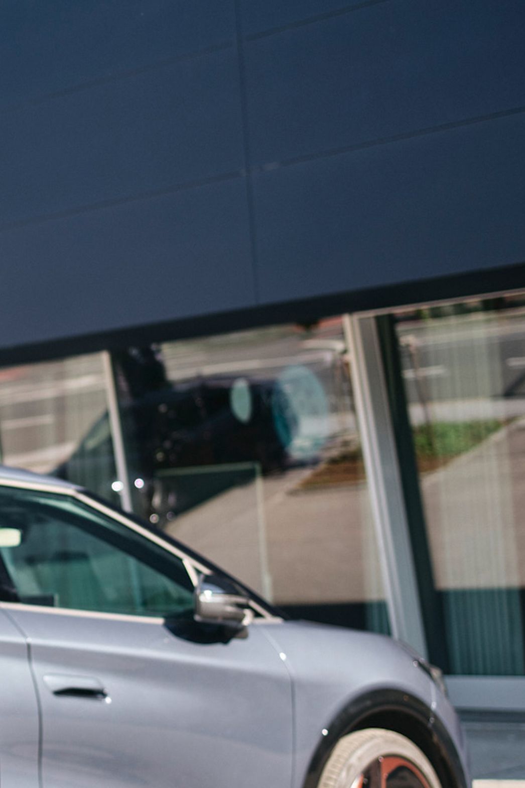 Charging station in front of a car with a display